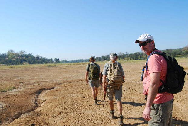 A walking safari heads out over the dry flood plain at Makuleke