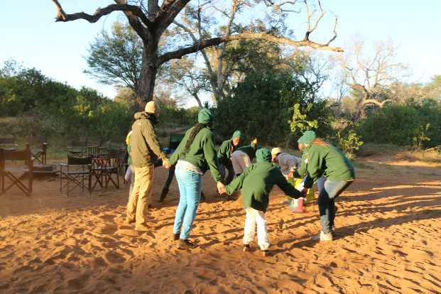 Morning wake up exercises with the children from the Children in the Wilderness programme.