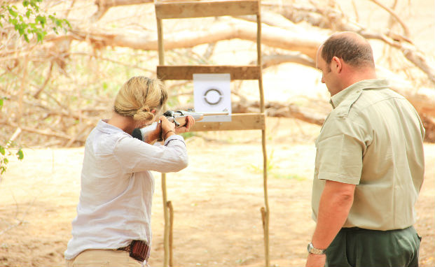 Safari guide student going through dry drills as part of advanced rifle handling